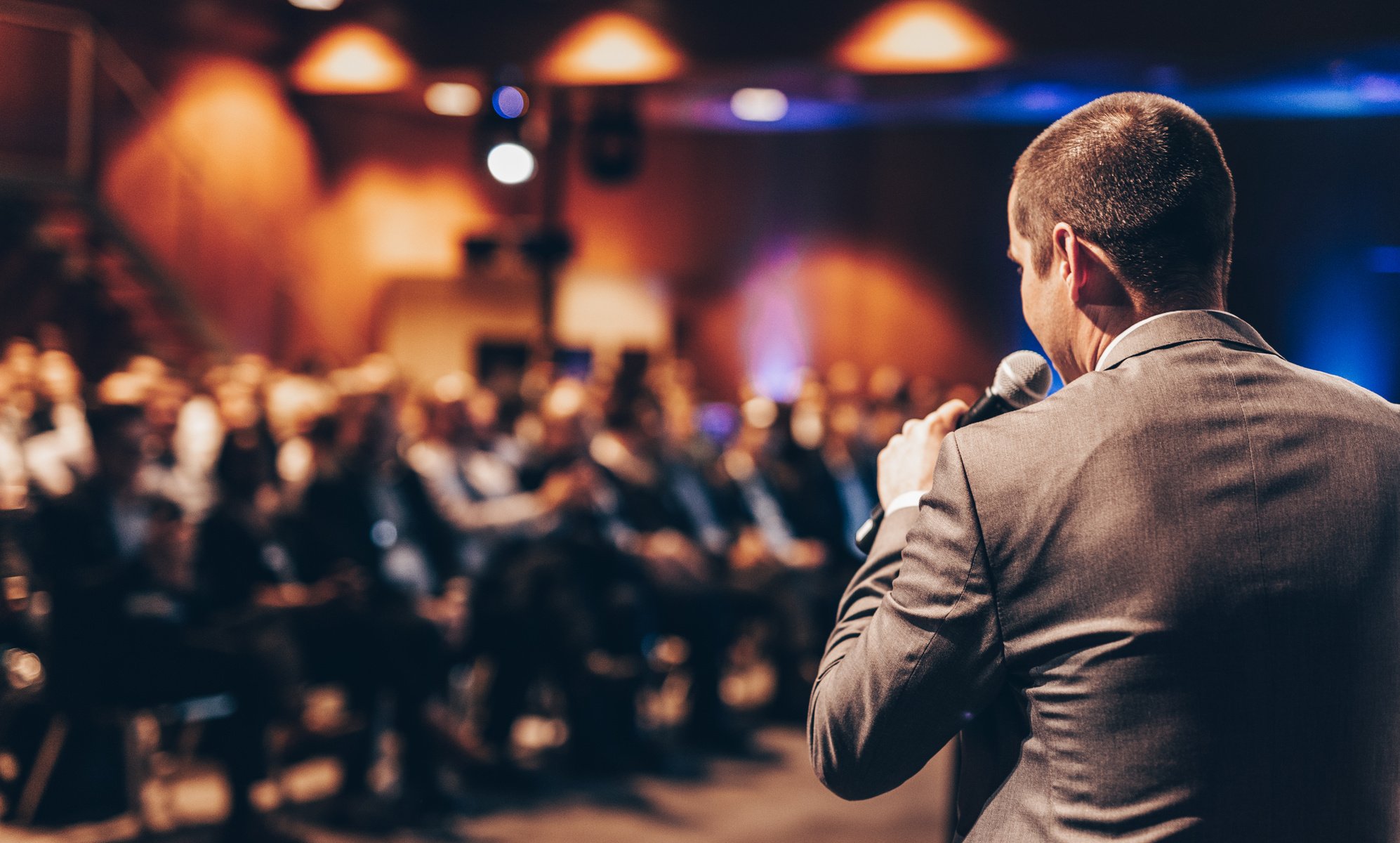 Public Speaker Giving Talk at Business Event.